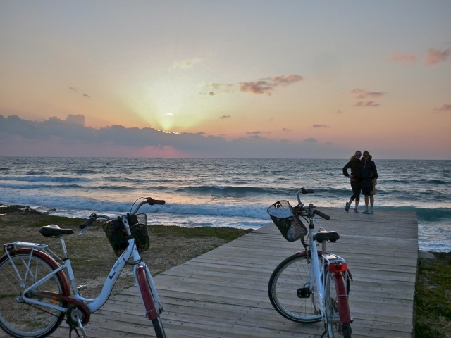 Biking on the promenade at sunset